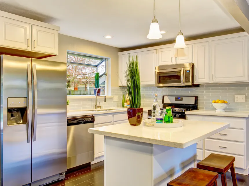 Kitchen With A Refrigerator, Dishwasher And Electric Range