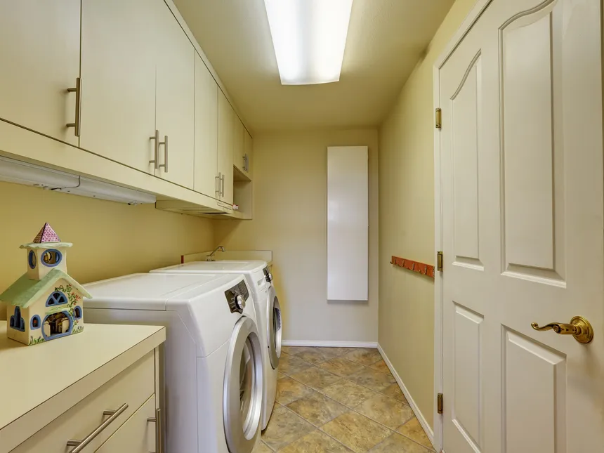 Front-Loading Washer And Dryer In A Laundry Room